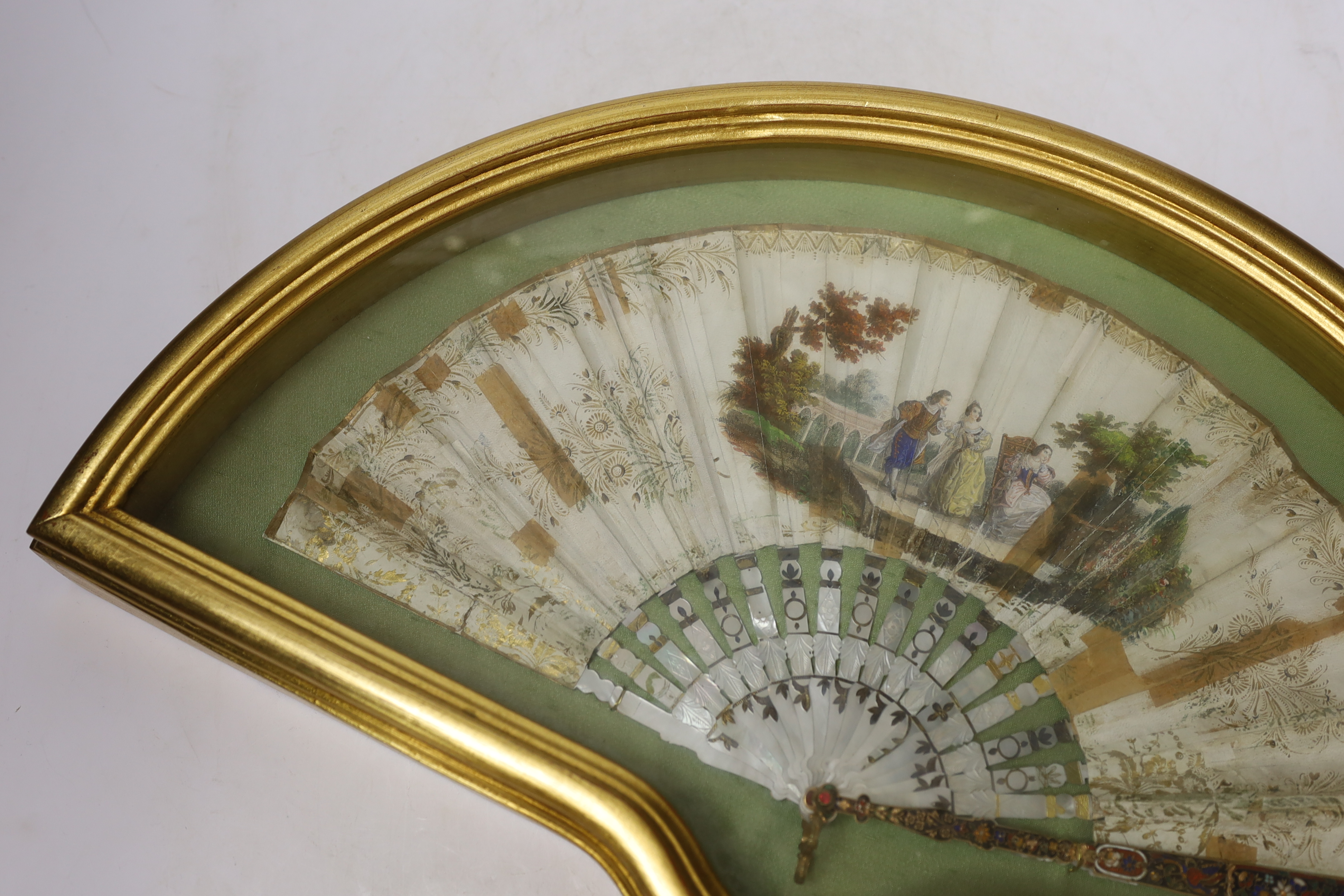 A cased early 19th century French mother of pearl, printed and painted fan
